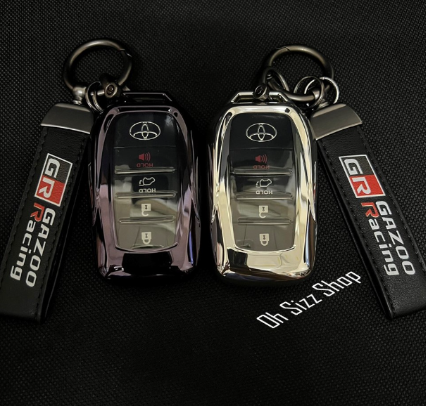 K01-เคสรีโมทรถ Toyota Fortuner GR Legender Revo GR Rocco ฝาหน้าปุ่มใสและหลังใสเห็นโลโก้ สีม่วงเข้มและเงินเงา พวงกุญแจ GR